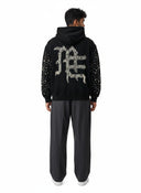 One Kickz sudadera negra con capucha adornada con perlas y pedrería en la espalda y mangas.