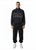 One Kickz Nude Project Classic Quarter-Zip negro con cremallera y logo bordado en blanco.