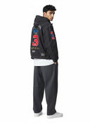 Chaqueta ligera con capucha negra Supreme La Martina de One Kickz con bordados deportivos y número 3 en la espalda