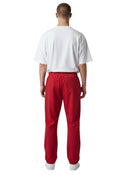 Pantalón de chándal rojo Supreme Umbro con detalles de pedrería, visto desde atrás en One Kickz