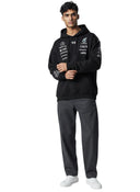 Hombre vistiendo sudadera negra con capucha adidas x Y-3 Mercedes AMG Petronas F1 de One Kickz con logos de patrocinio