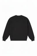 Vista trasera del suéter negro Supreme Flocked Logo Sweater de One Kickz con tejido de punto y cuello redondo
