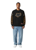 Modelo vistiendo suéter negro de punto Supreme Fox Racing con logotipos en pecho y mangas, de One Kickz